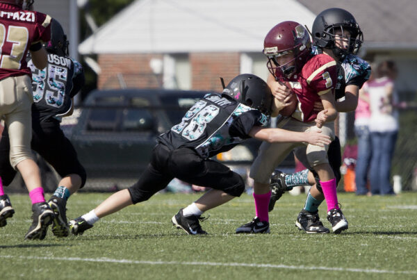 "Football Poquoson Bulls Back River Panthers PYFCO Mites Midgets Juniors youth sports Virginia Va." by watts_photos is marked with Public Domain Mark 1.0. To view the terms, visit https://creativecommons.org/publicdomain/mark/1.0/?ref=openverse.
