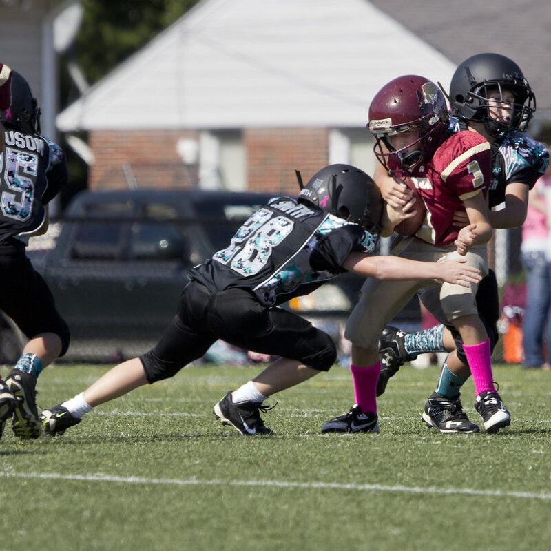"Football Poquoson Bulls Back River Panthers PYFCO Mites Midgets Juniors youth sports Virginia Va." by watts_photos is marked with Public Domain Mark 1.0. To view the terms, visit https://creativecommons.org/publicdomain/mark/1.0/?ref=openverse.
