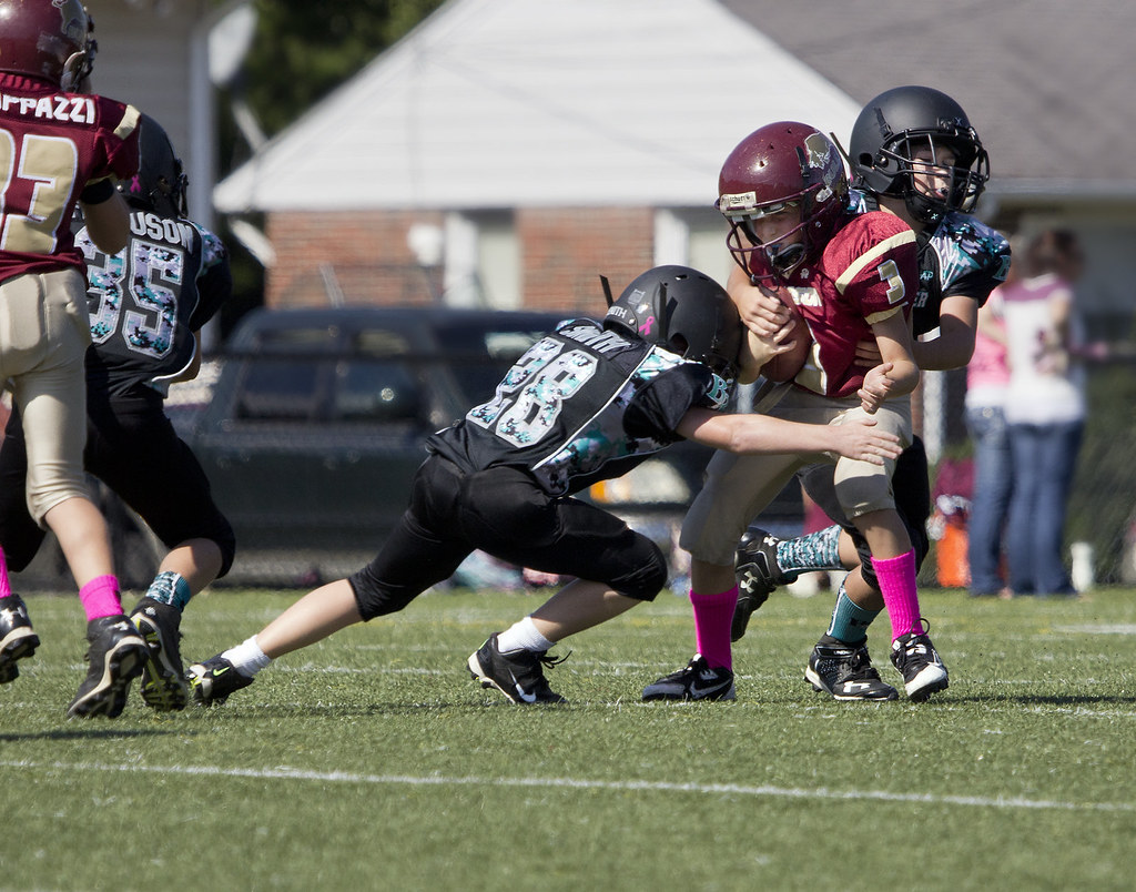 "Football Poquoson Bulls Back River Panthers PYFCO Mites Midgets Juniors youth sports Virginia Va." by watts_photos is marked with Public Domain Mark 1.0. To view the terms, visit https://creativecommons.org/publicdomain/mark/1.0/?ref=openverse.